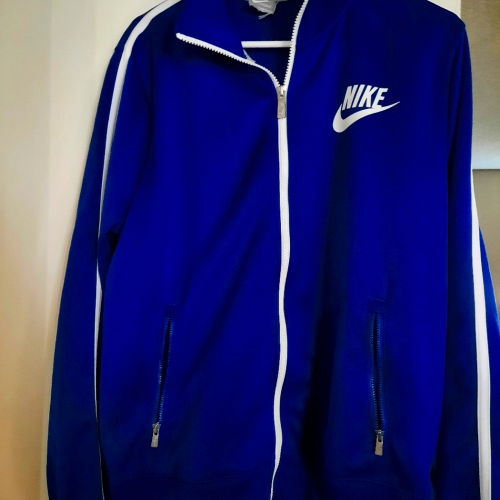 Blue Nike zip up. Size large 100% polyester.